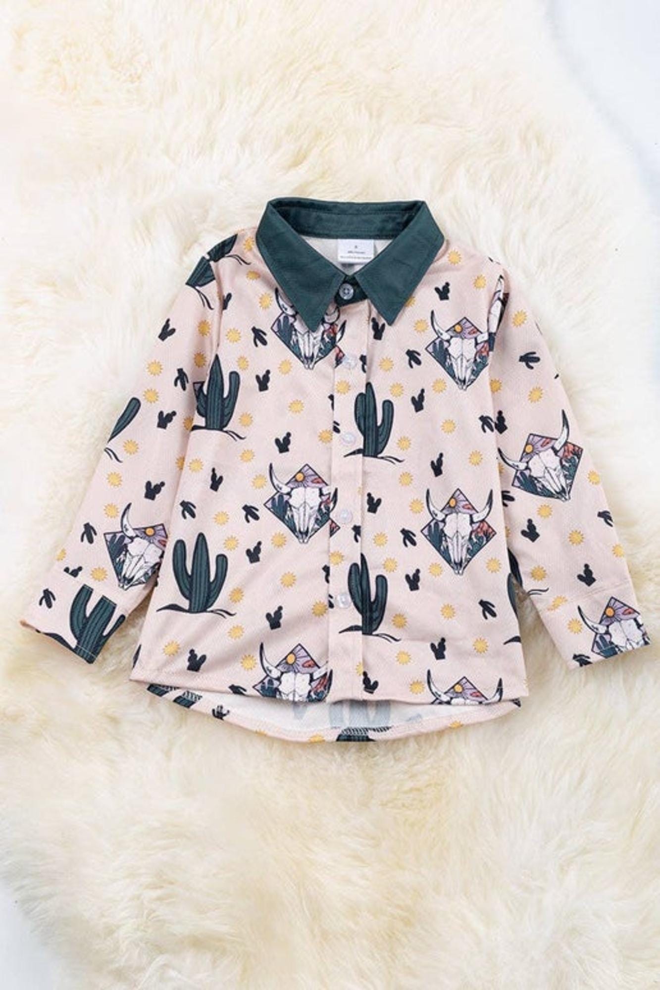 Boys bull skull printed on ivory button up shirt.