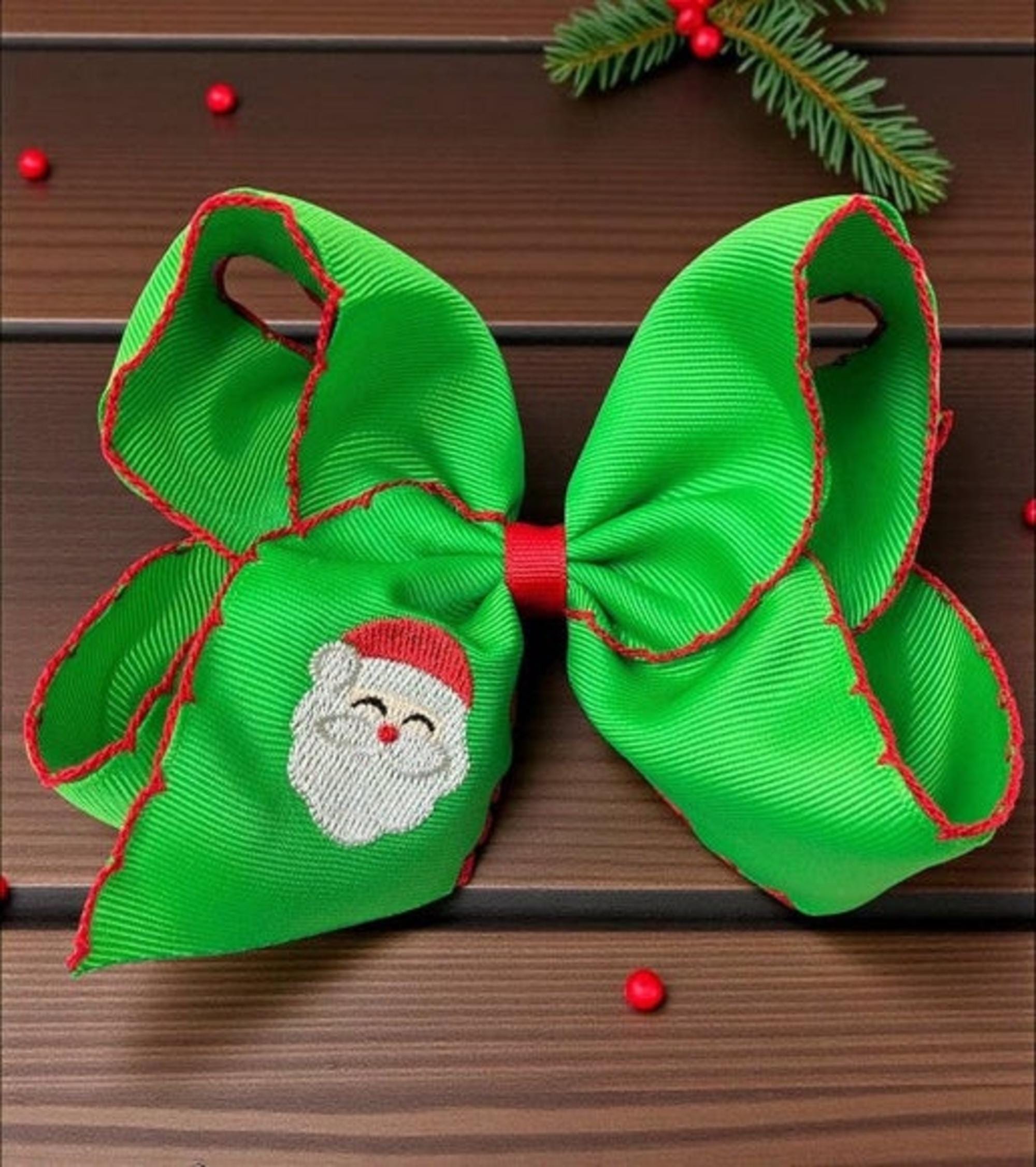 5" Green Santa embroidered and moon stitch trim.