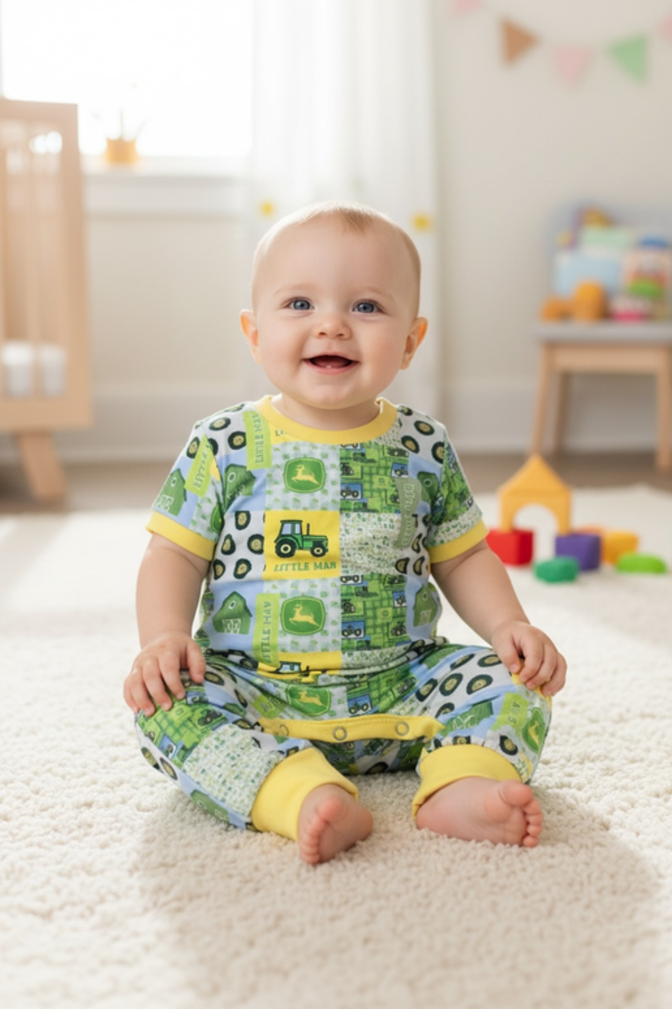 Little man" Tractor printed boys baby romper w/yellow trim.