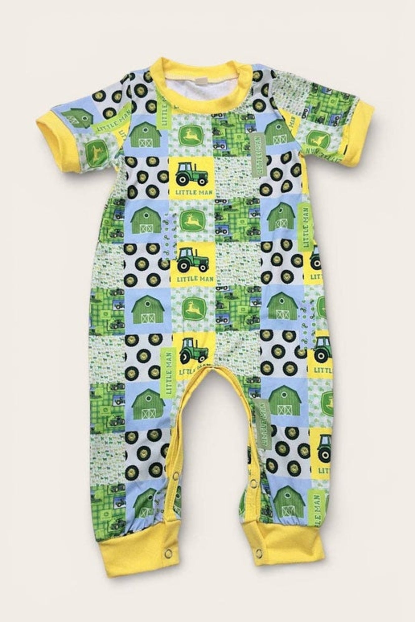 Little man" Tractor printed boys baby romper w/yellow trim.