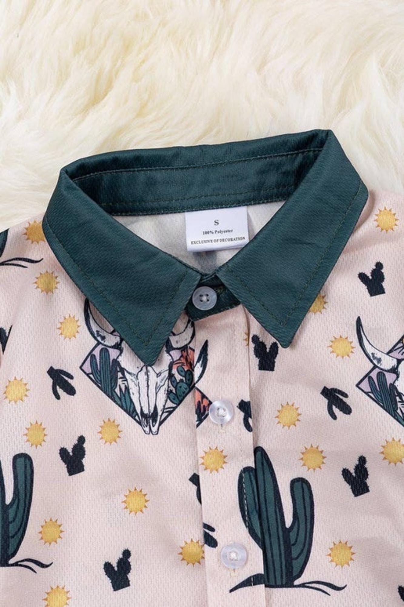 Boys bull skull printed on ivory button up shirt.